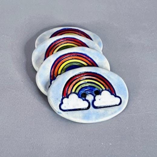 Large Rainbow on Light Blue Oval Button