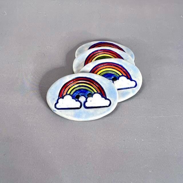 Large Rainbow on Light Blue Oval Button