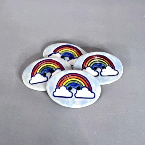 Large Rainbow on Light Blue Oval Button