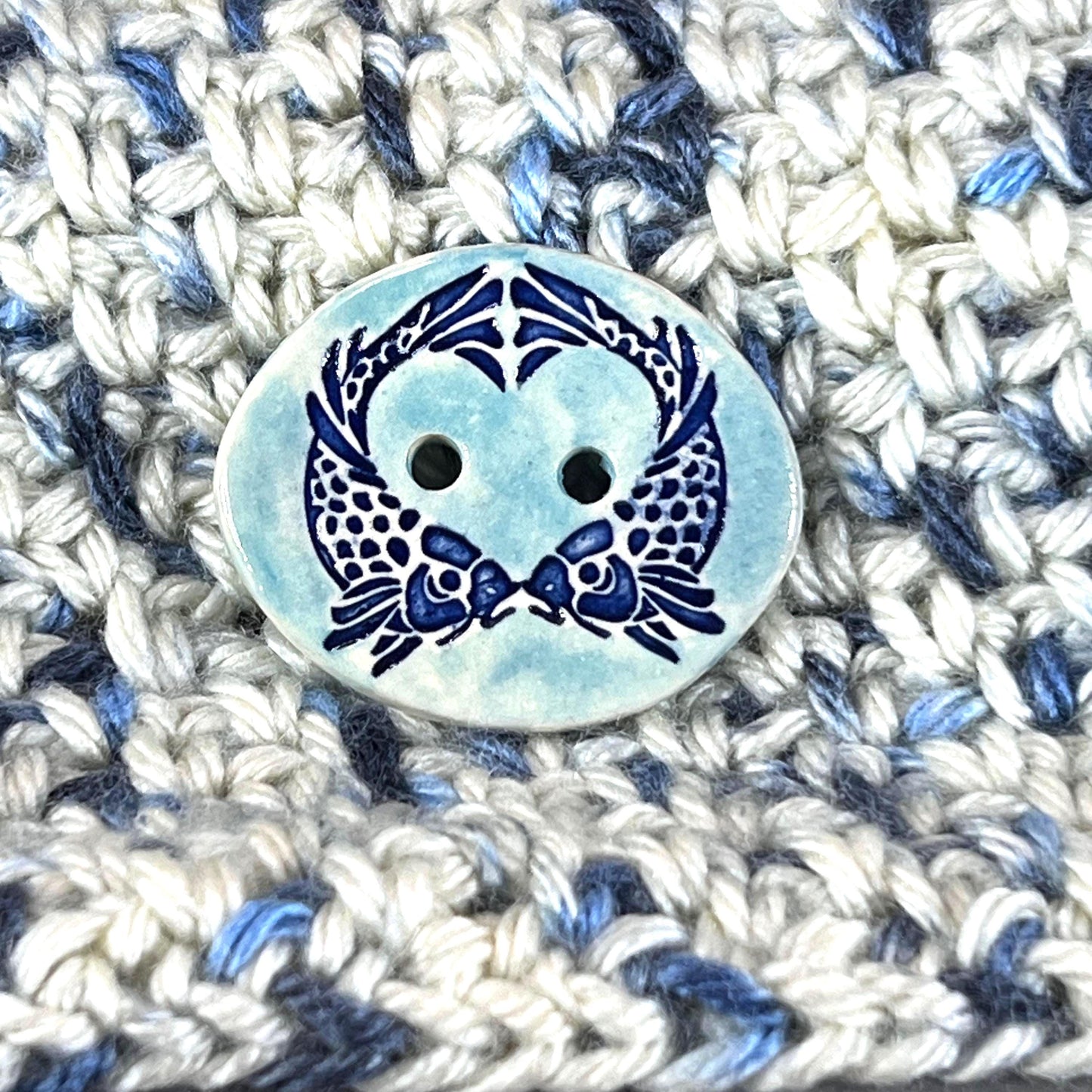 Two Koi Heart on Light Blue Oval Button
