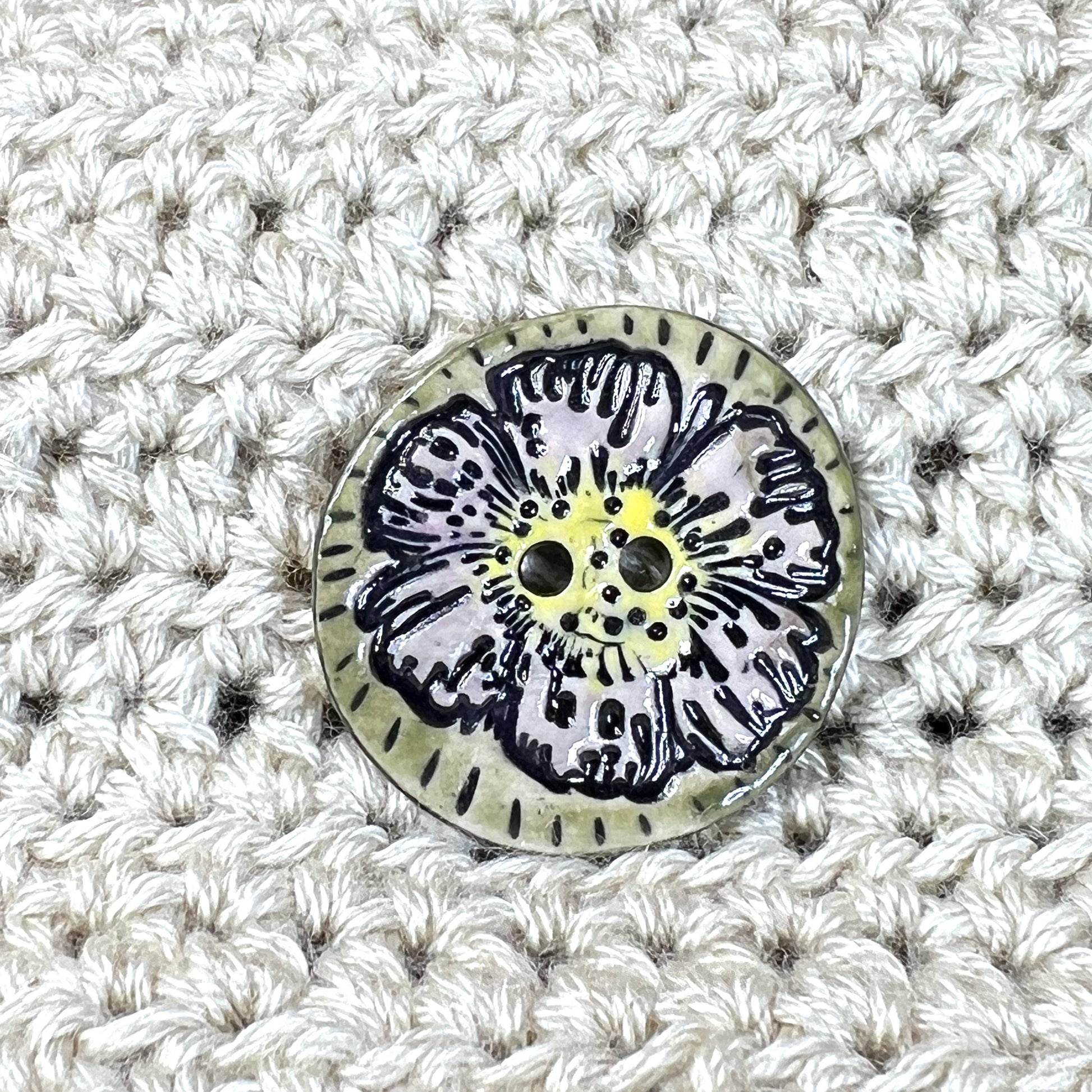 Large Button with Light Lavender Flower and Green Border