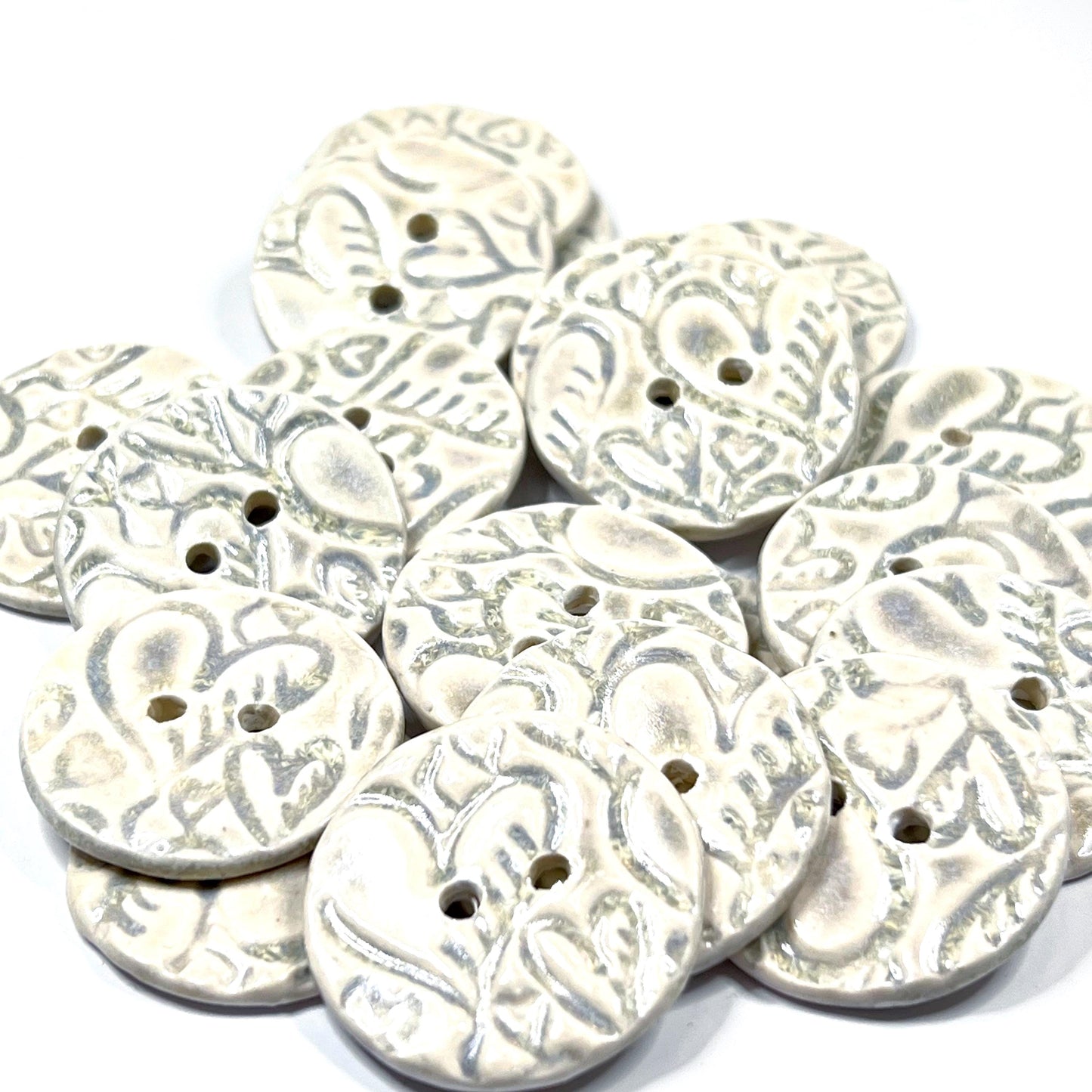 4 White Round Buttons with Light Gray Heart Pattern
