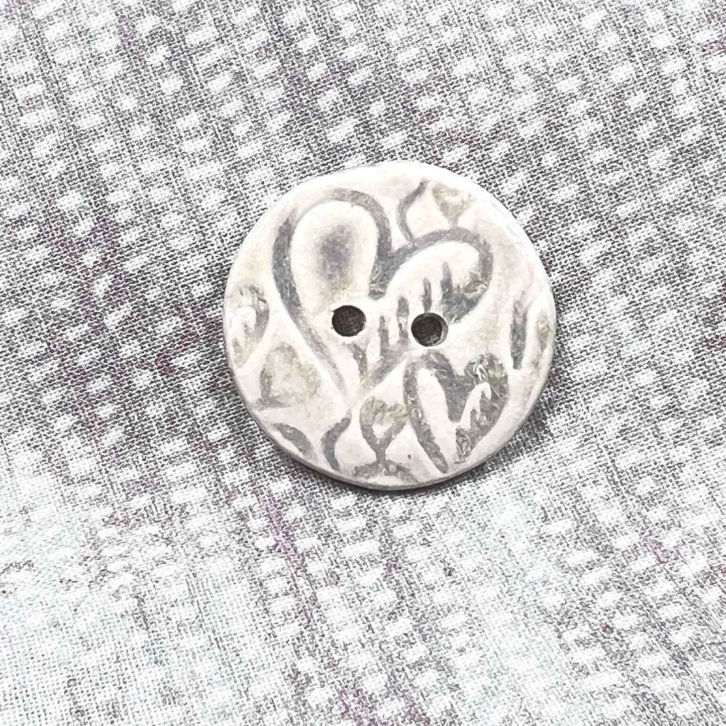 4 White Round Buttons with Light Gray Heart Pattern