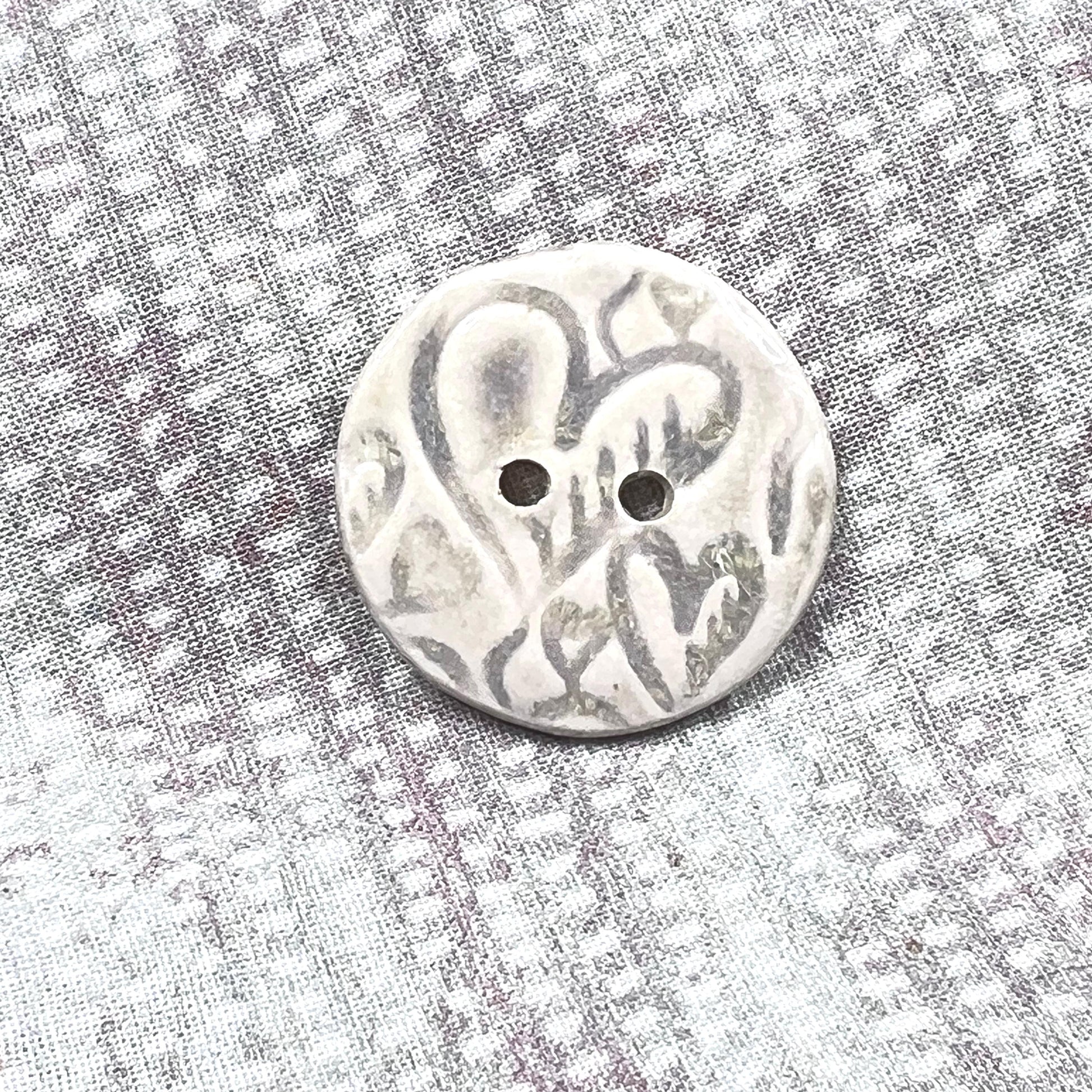 4 White Round Buttons with Light Gray Heart Pattern