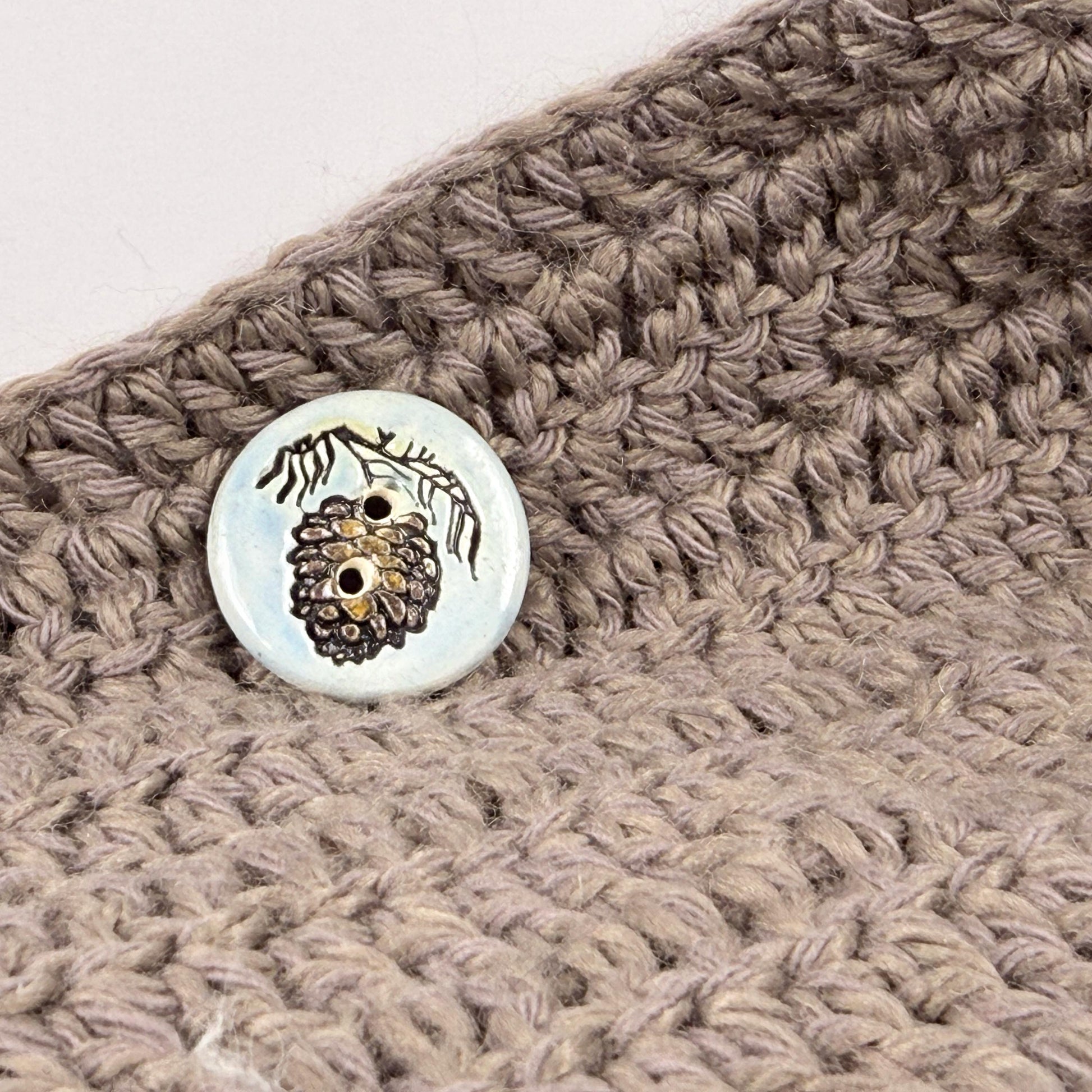 Pinecone with Pine Branch on Blue Round Ceramic Buttons