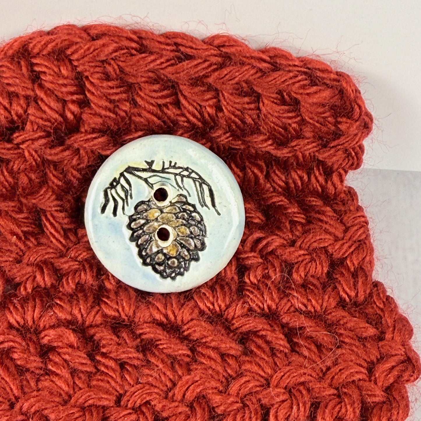 Pinecone with Pine Branch on Blue Round Ceramic Buttons