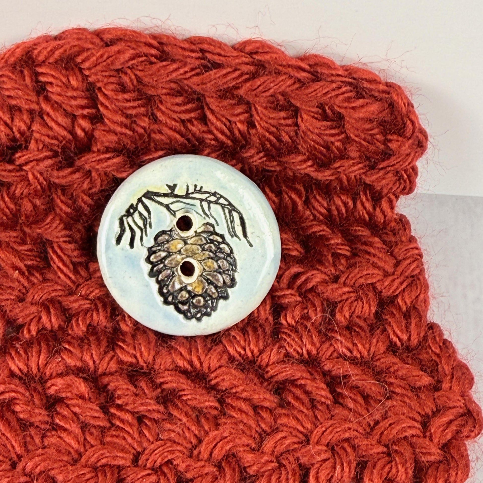 Pinecone with Pine Branch on Blue Round Ceramic Buttons