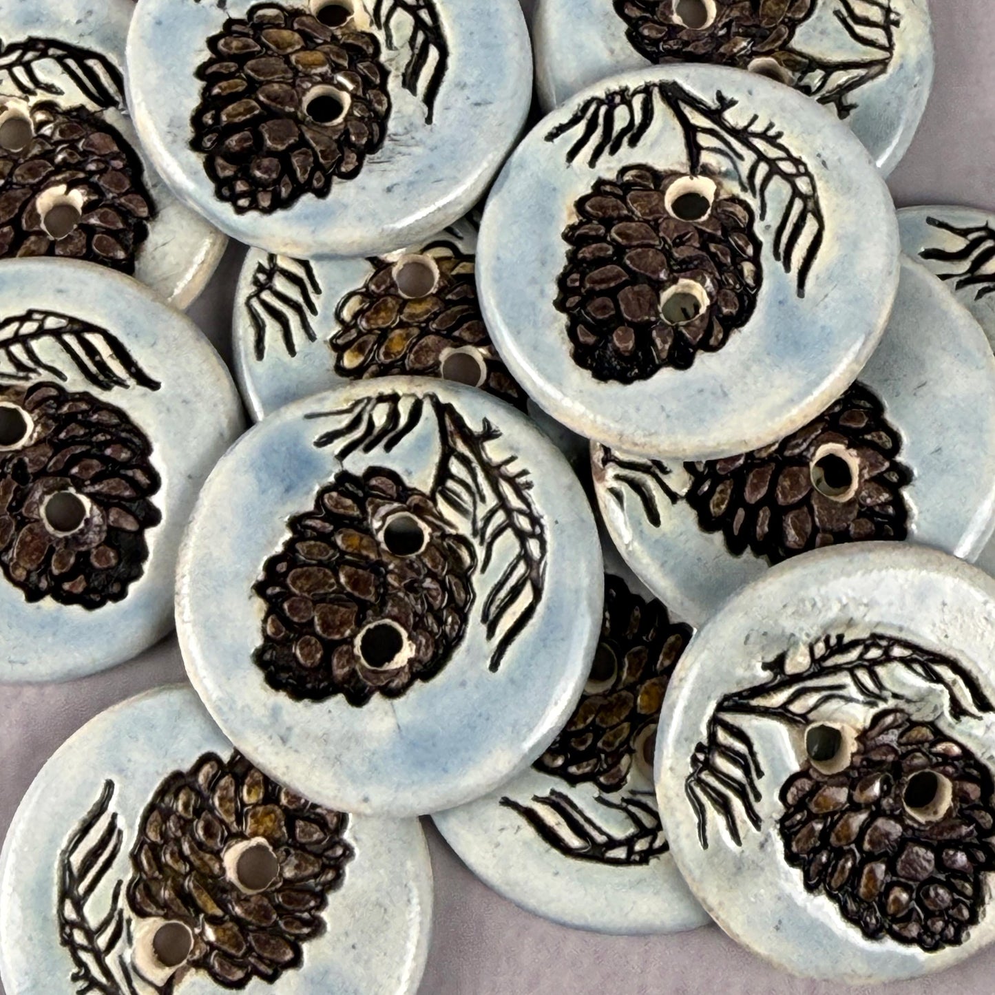 Pinecone with Pine Branch on Blue Round Ceramic Buttons