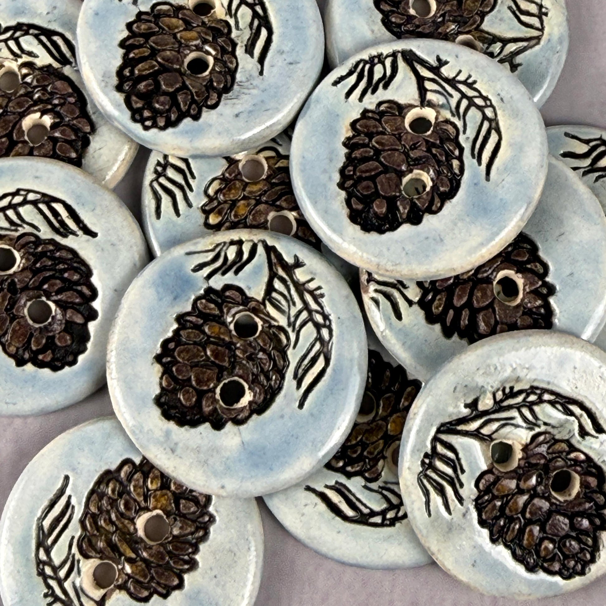 Pinecone with Pine Branch on Blue Round Ceramic Buttons