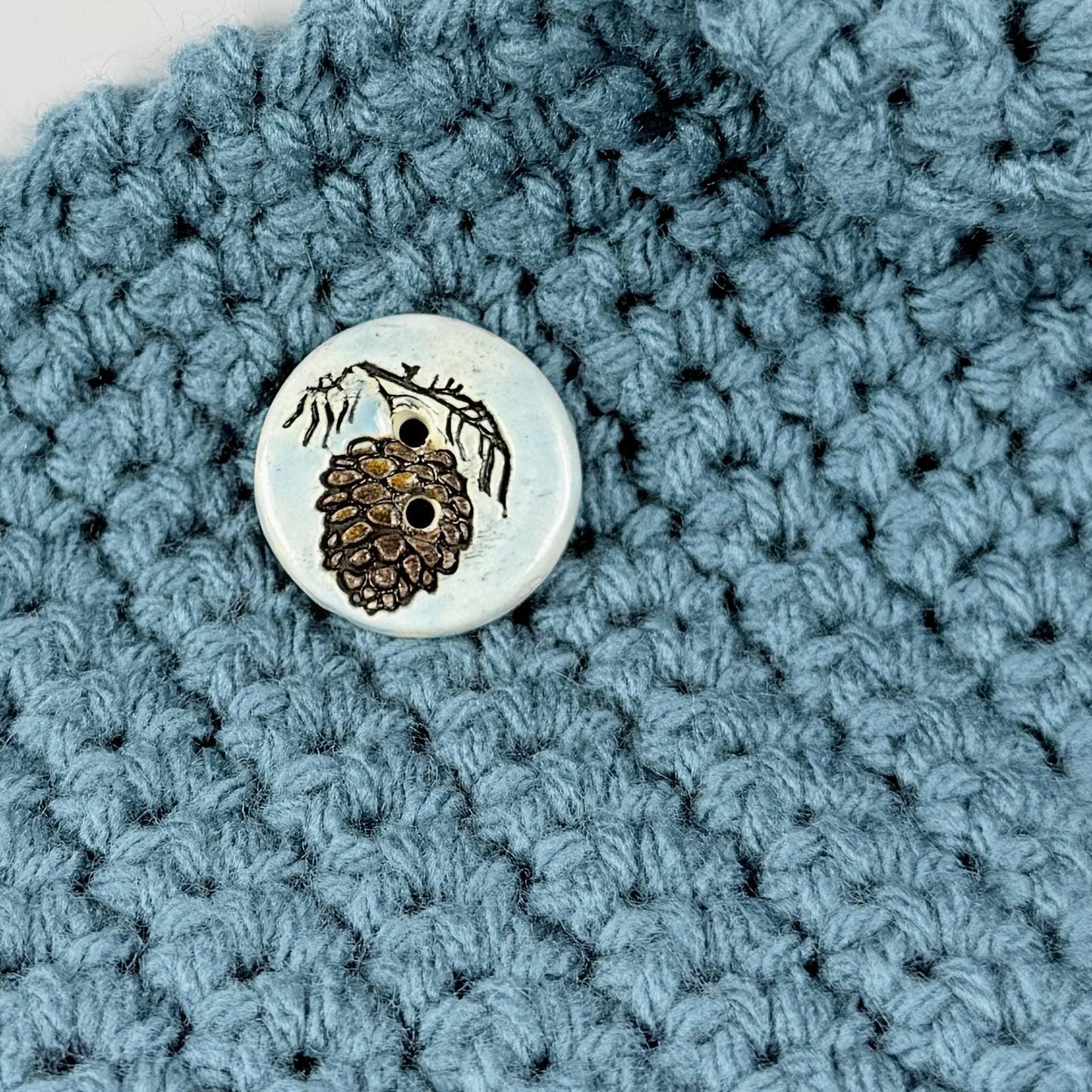 Pinecone with Pine Branch on Blue Round Ceramic Buttons
