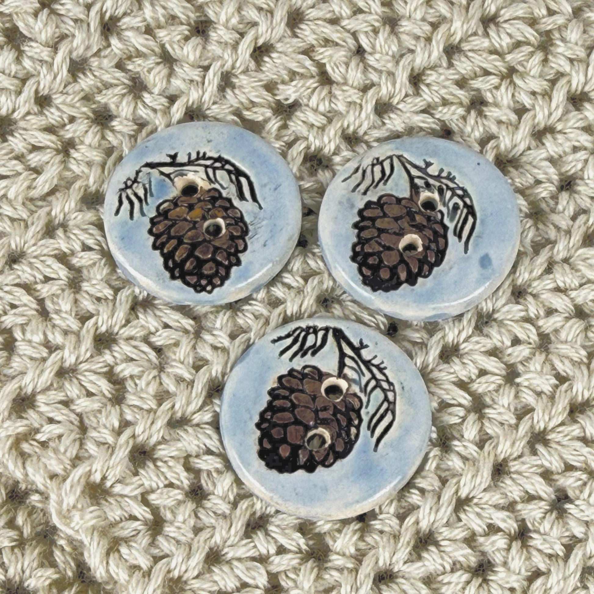 Pinecone with Pine Branch on Blue Round Ceramic Buttons