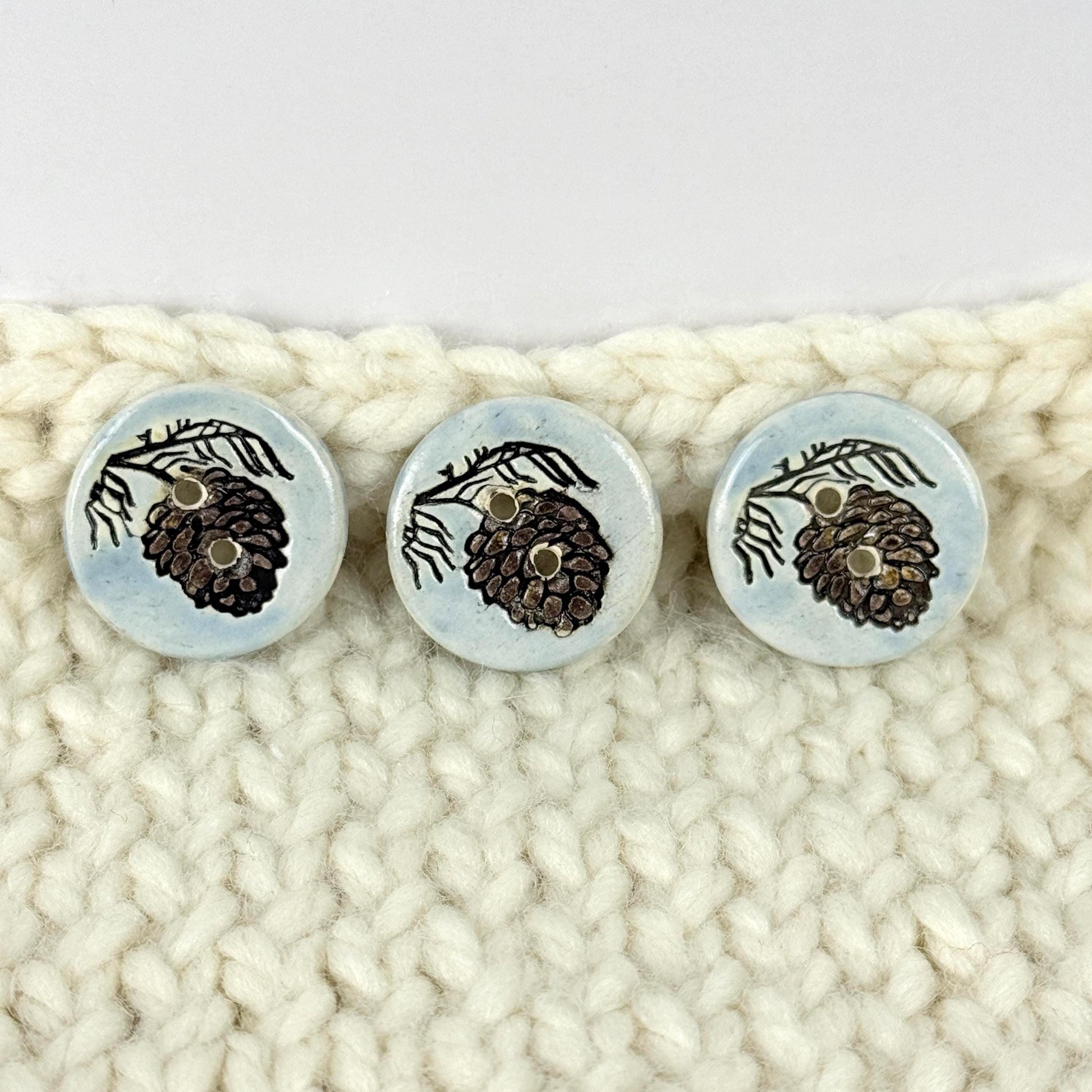 Pinecone with Pine Branch on Blue Round Ceramic Buttons