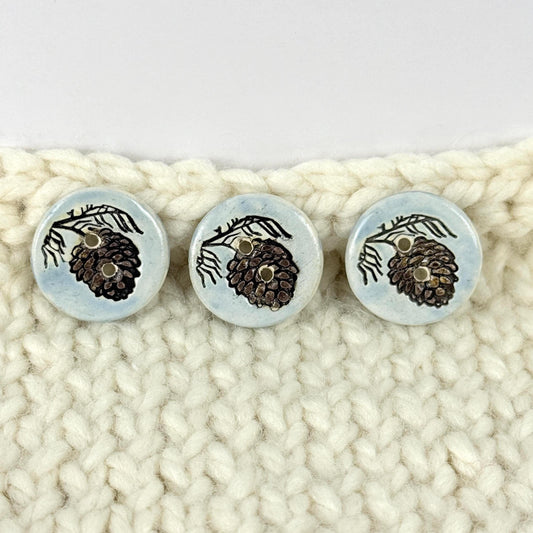 Pinecone with Pine Branch on Blue Round Ceramic Buttons