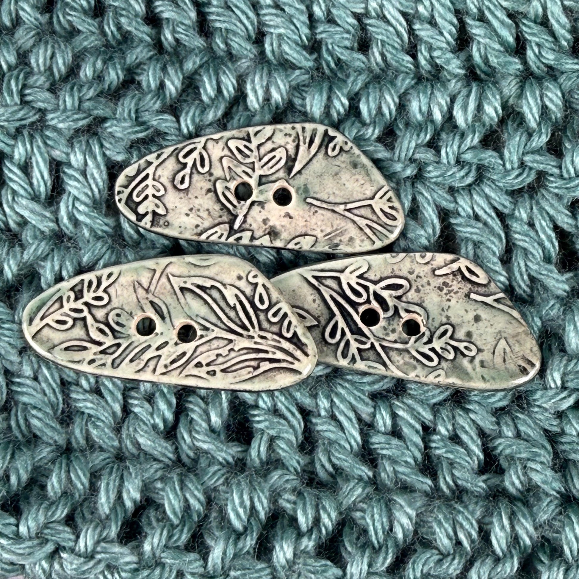 Green Washed Triangular Button with Flower and Plant Texture