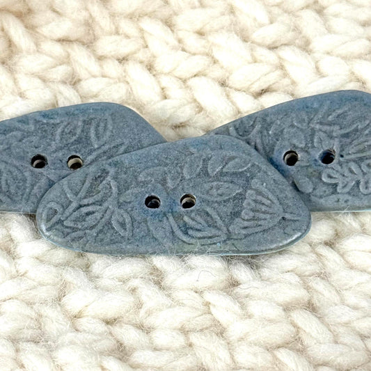 Blue Matte Triangular Button with Flower and Plant Texture