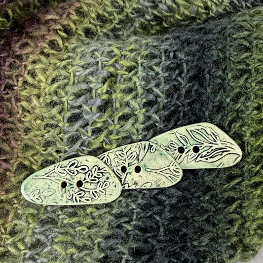 Green Washed Triangular Button with Flower and Plant Texture