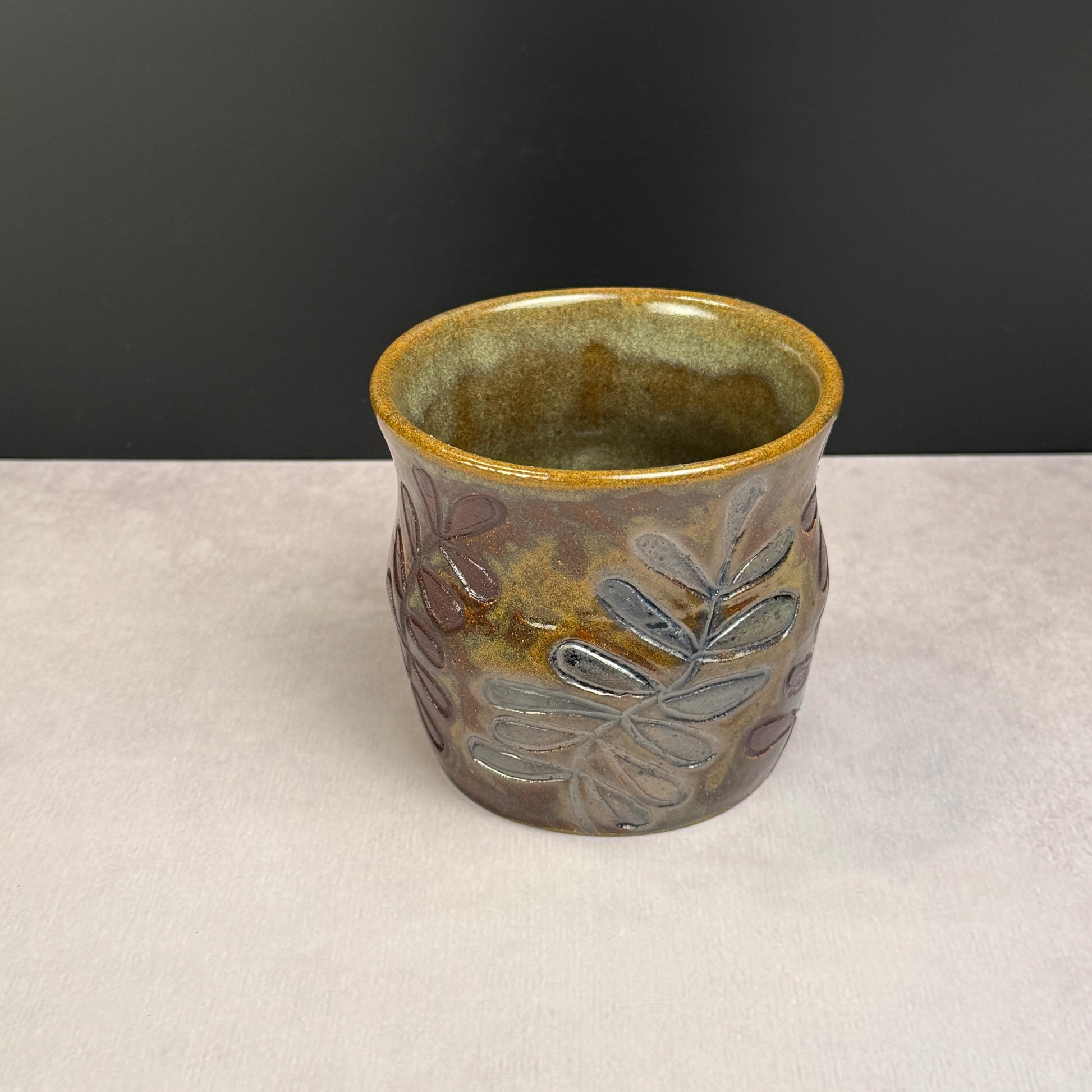Brown Leaves on a Brown and Green Stoneware Pot/Desk Caddy
