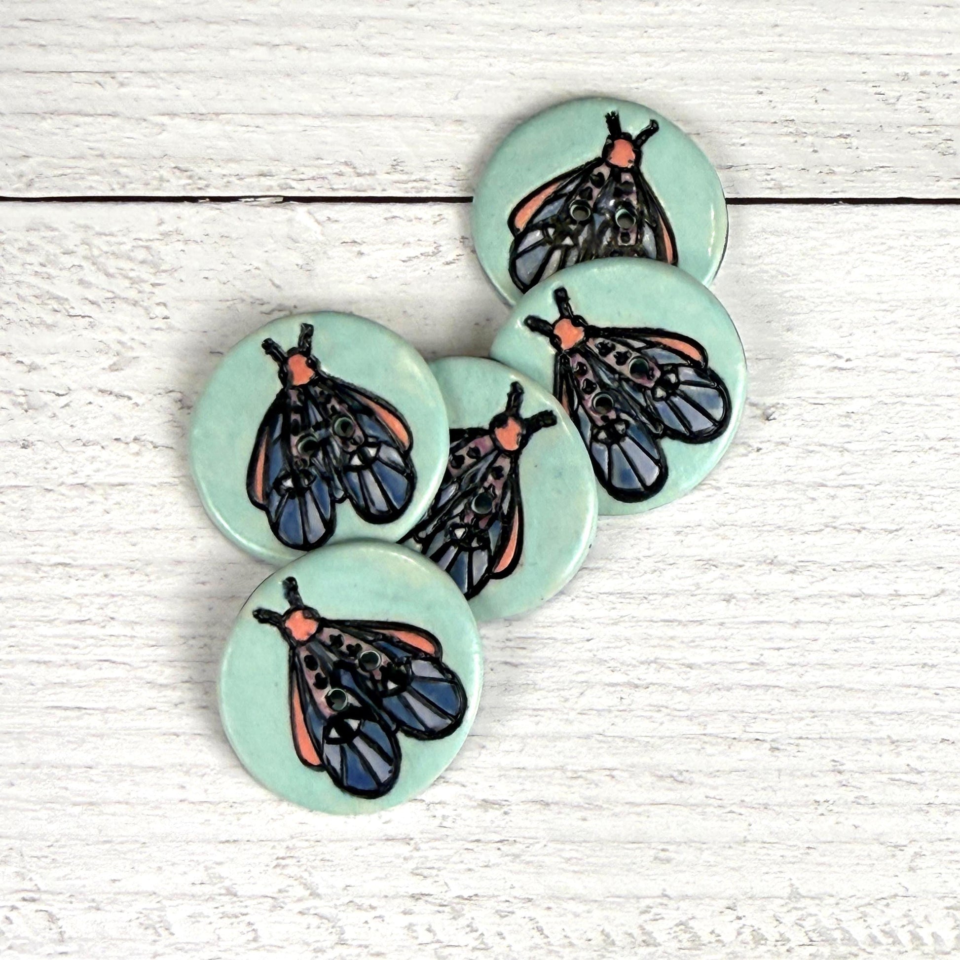 Blue Moth with Eyes on Aqua Blue Ceramic Button