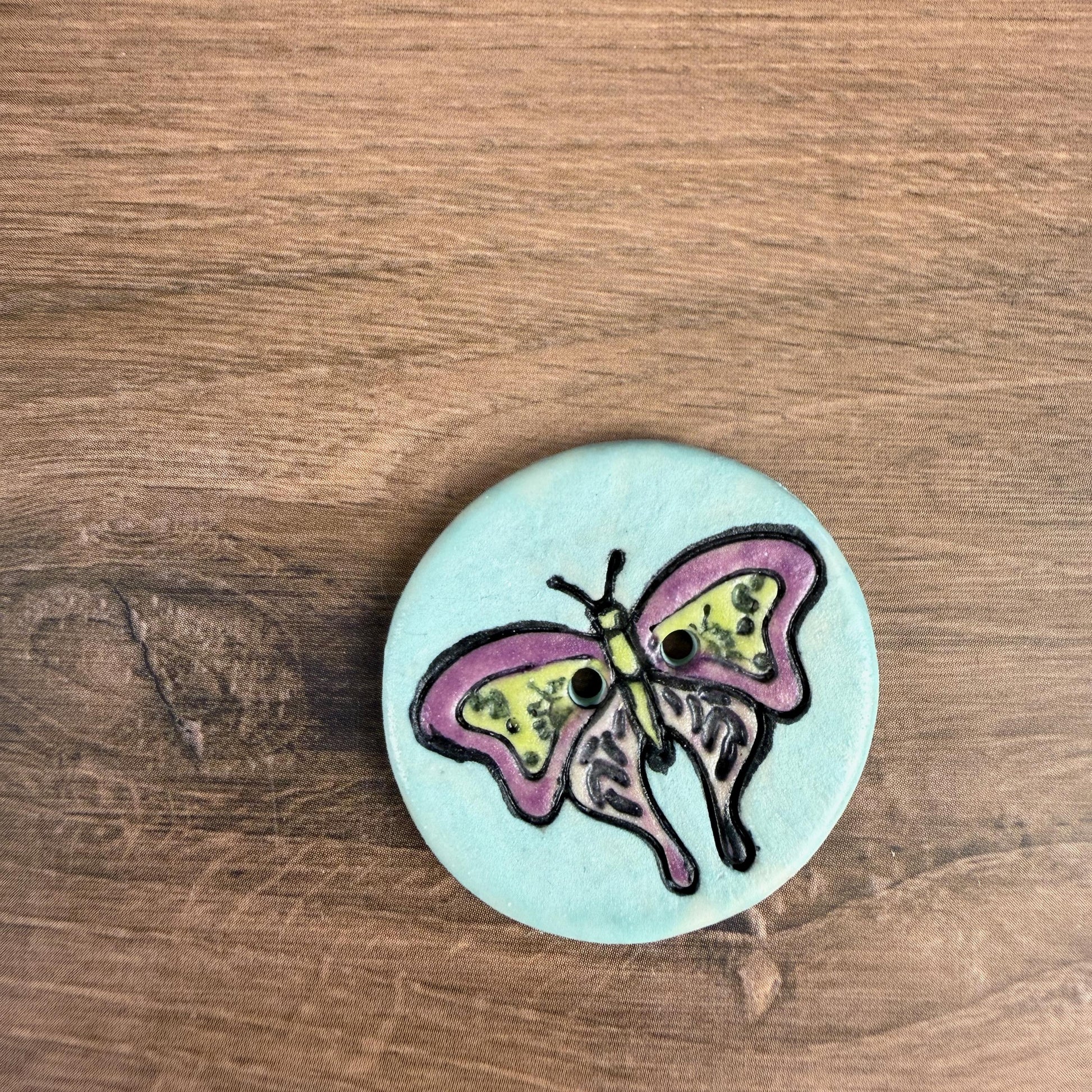 Red Violet Moth with Yellow on Aqua Blue Ceramic Button