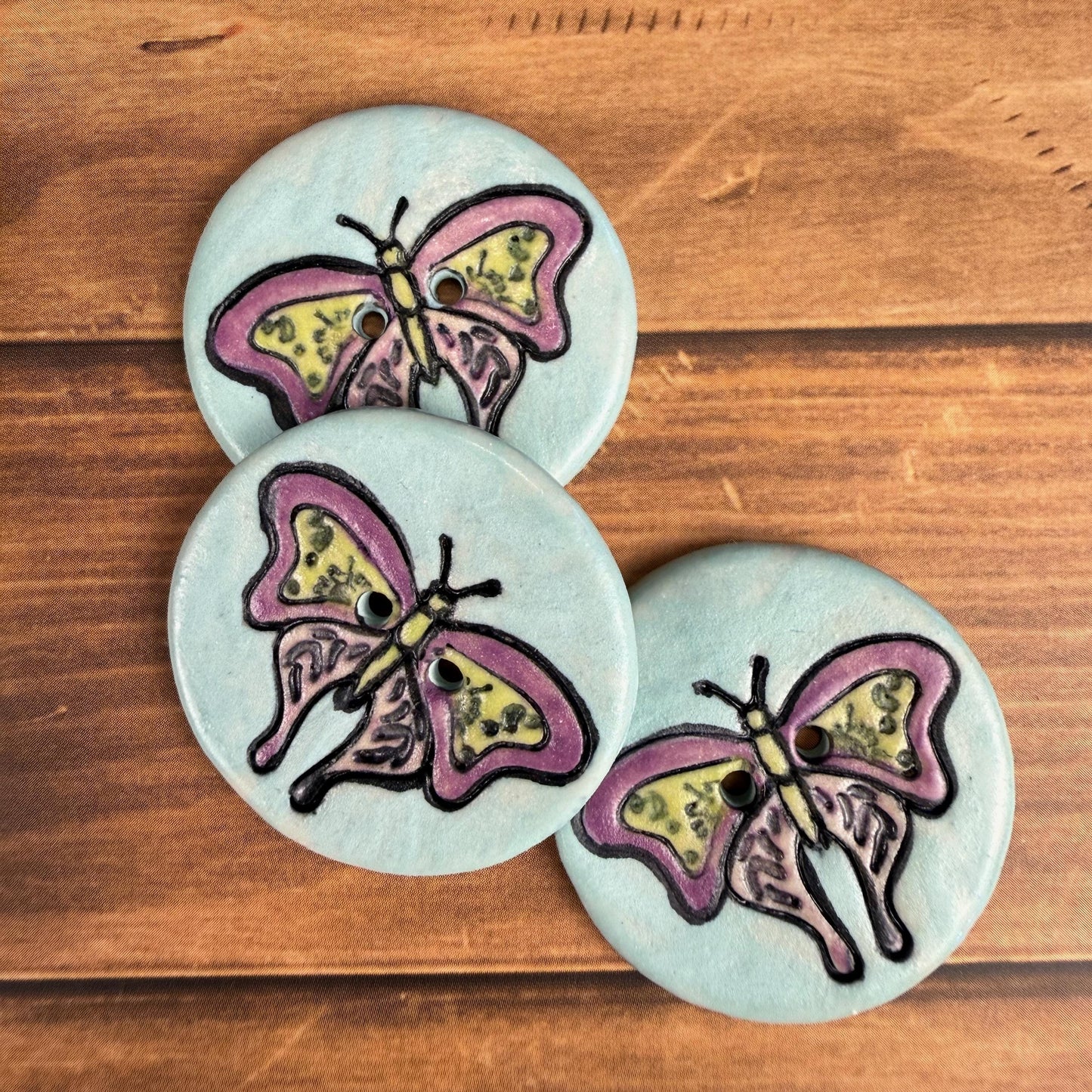 Red Violet Moth with Yellow on Aqua Blue Ceramic Button