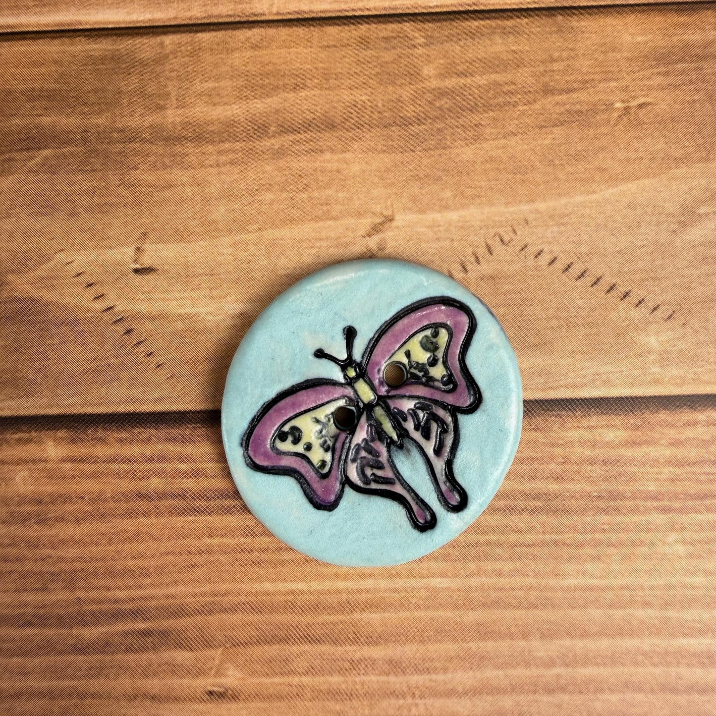 Red Violet Moth with Yellow on Aqua Blue Ceramic Button
