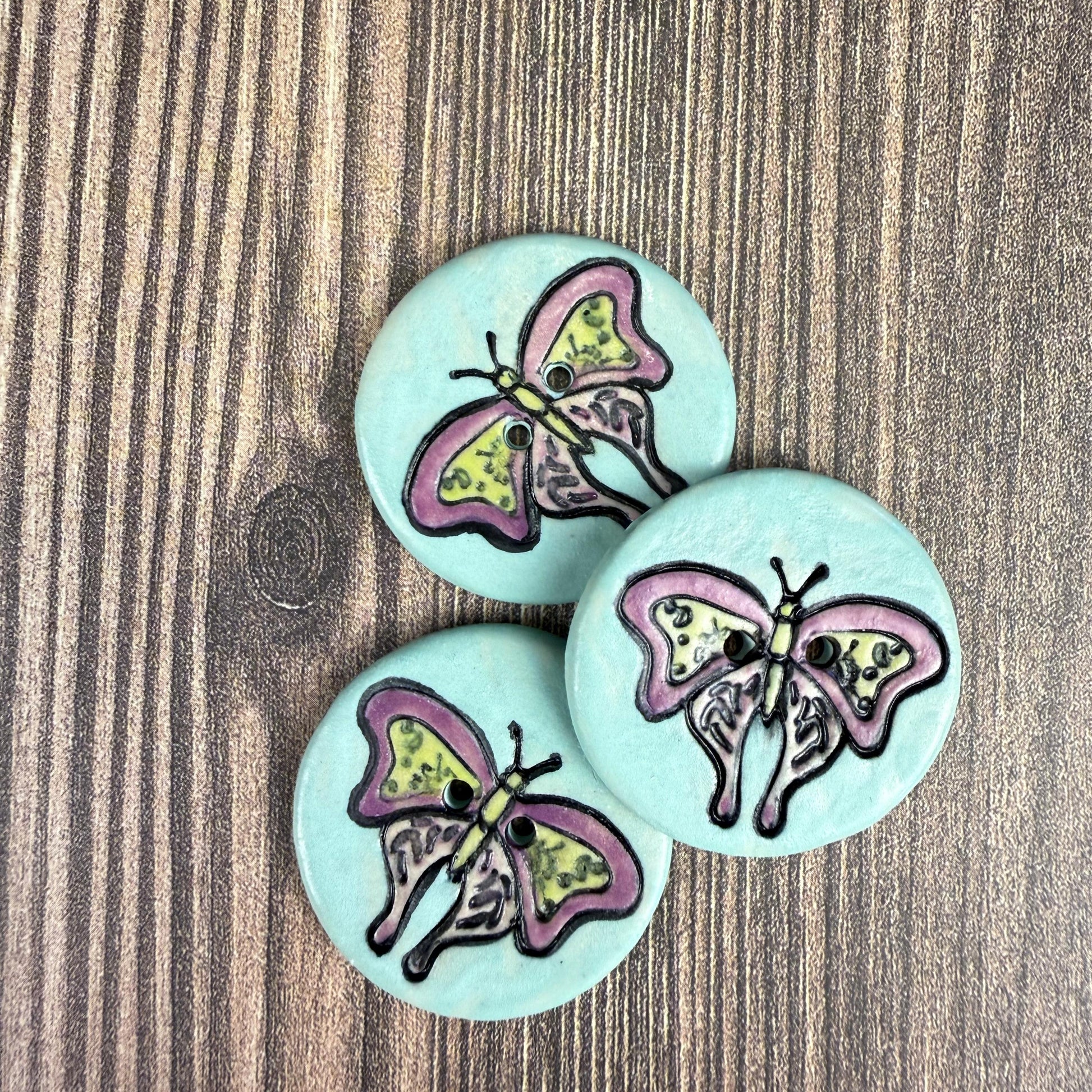 Red Violet Moth with Yellow on Aqua Blue Ceramic Button