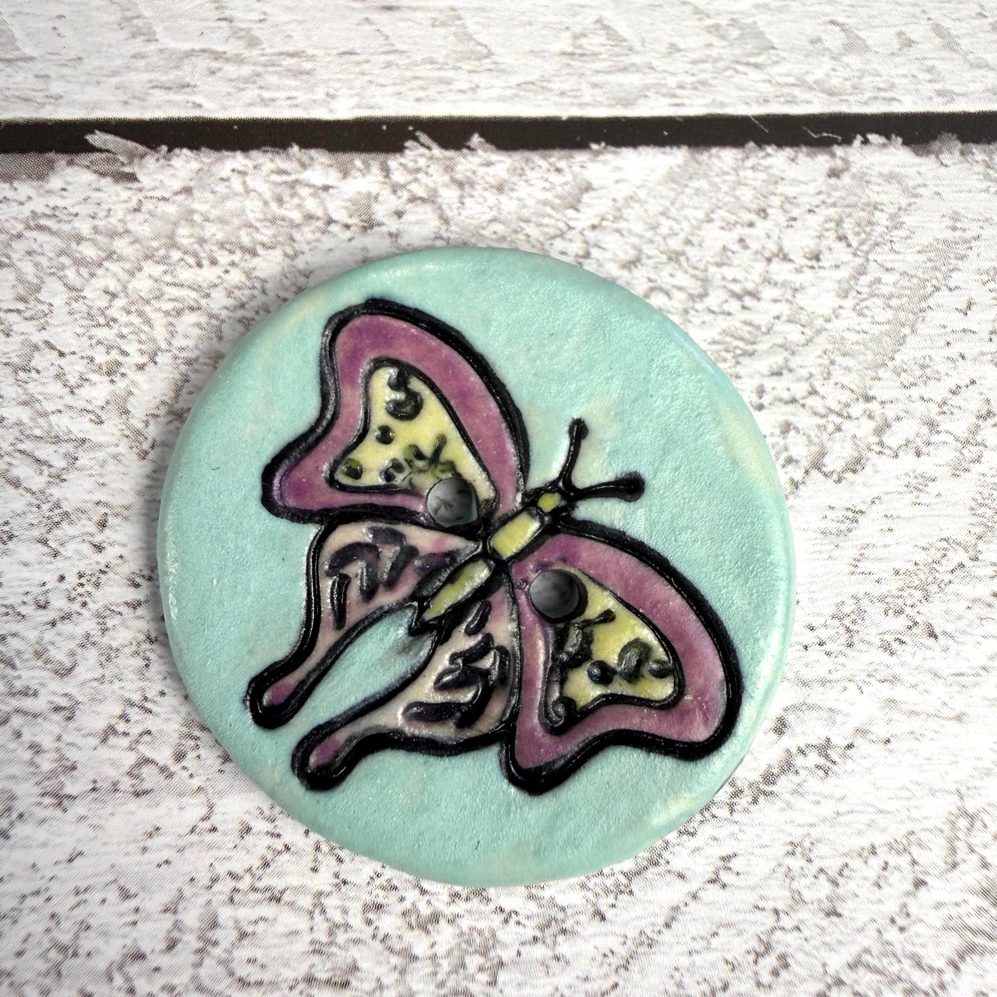 Red Violet Moth with Yellow on Aqua Blue Ceramic Button