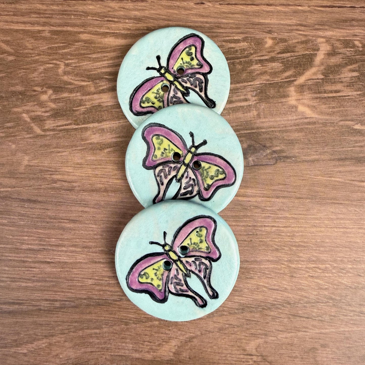 Red Violet Moth with Yellow on Aqua Blue Ceramic Button