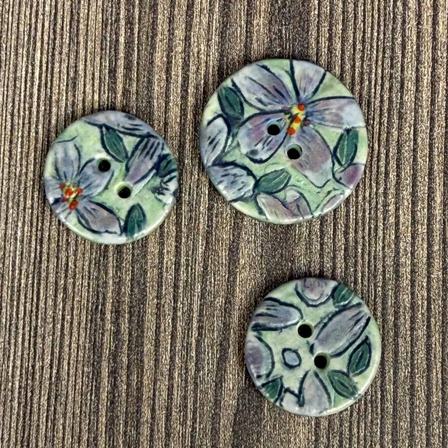 Small Purple Flowers on Green Round Buttons