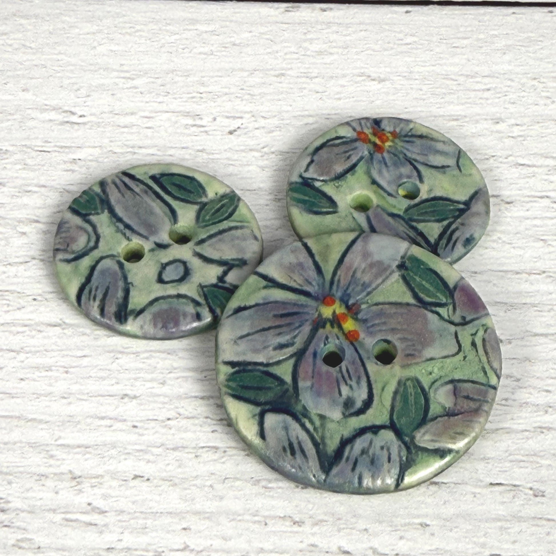 Small Purple Flowers on Green Round Buttons