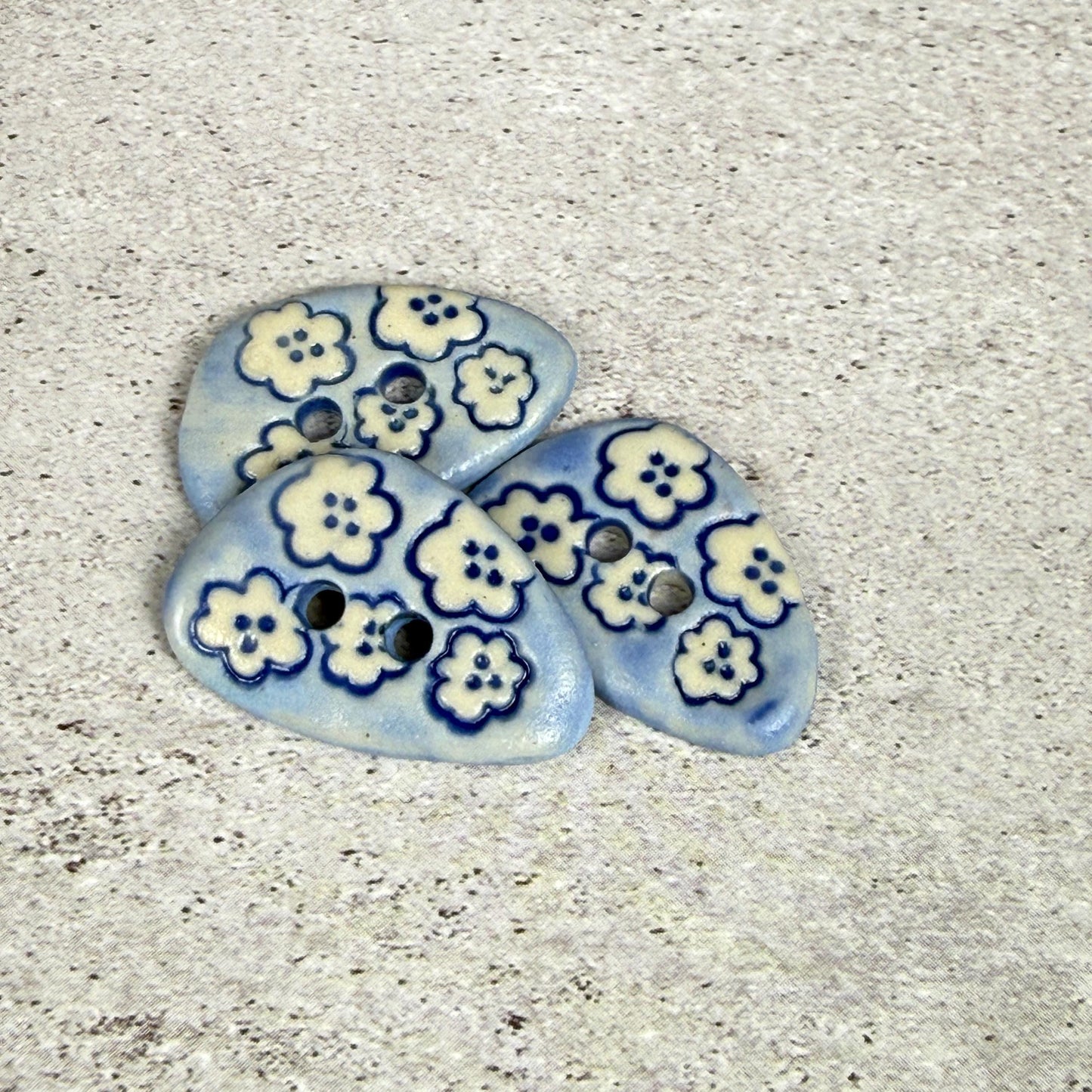 Set of 5 Small Blue Triangular Shaped Buttons with White Flowers