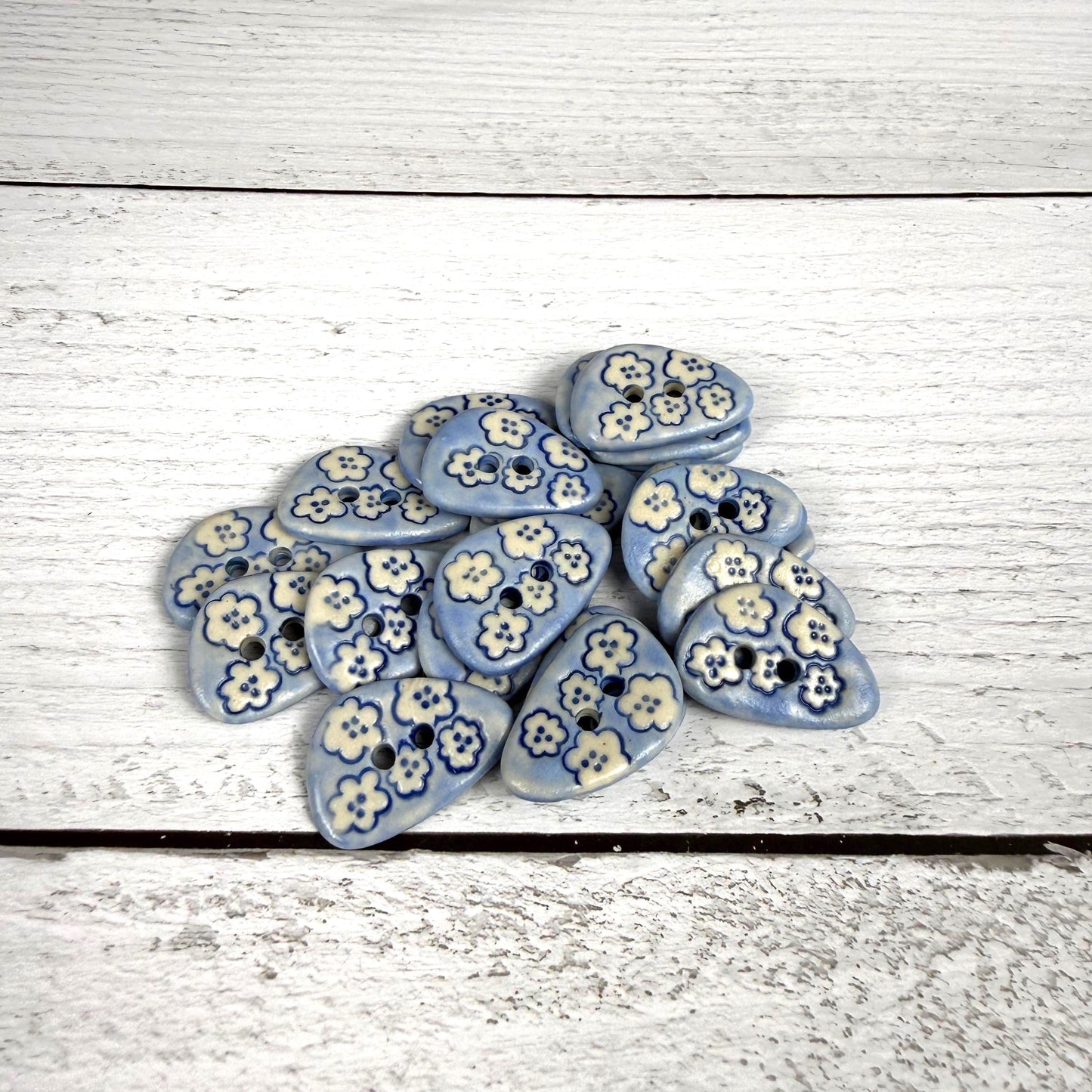 Set of 5 Small Blue Triangular Shaped Buttons with White Flowers