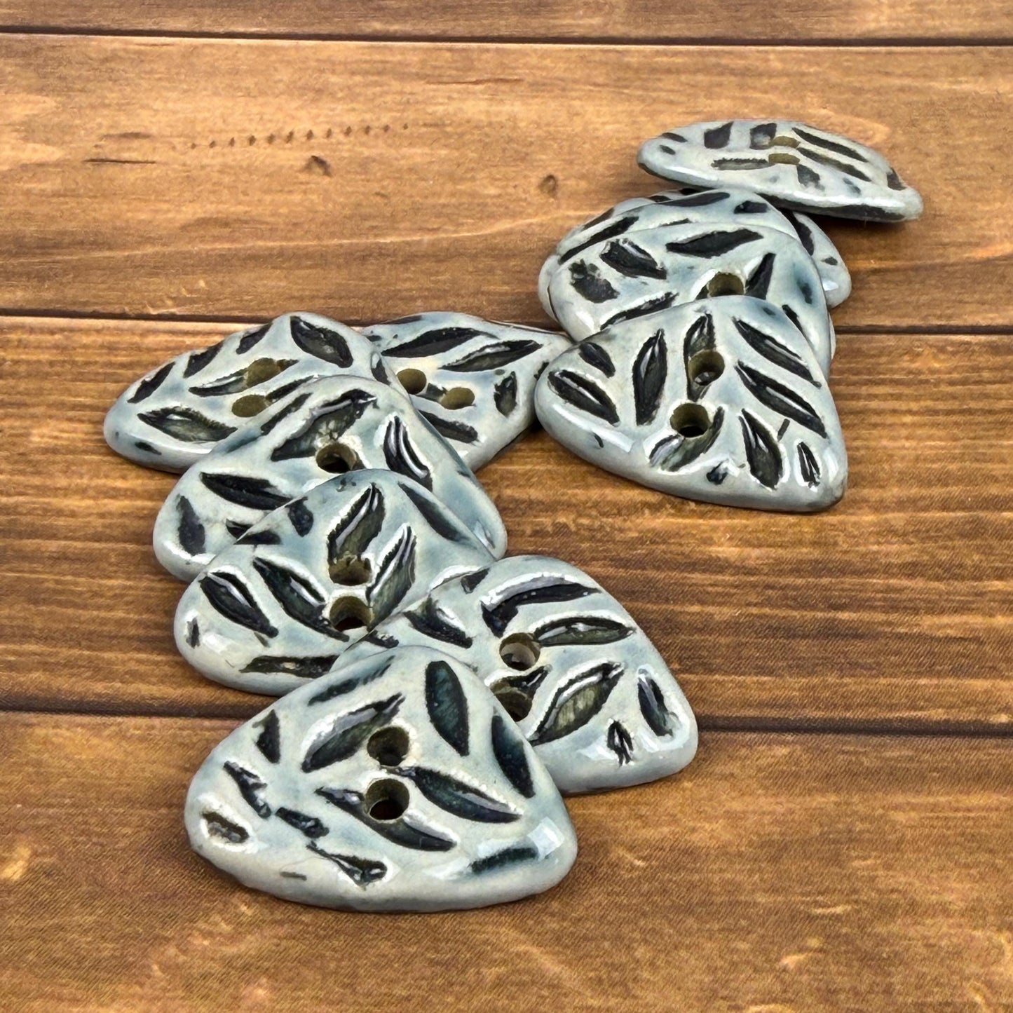 Small Triangular Shaped Buttons in Light Sage with Dark Sage Leaf Pattern
