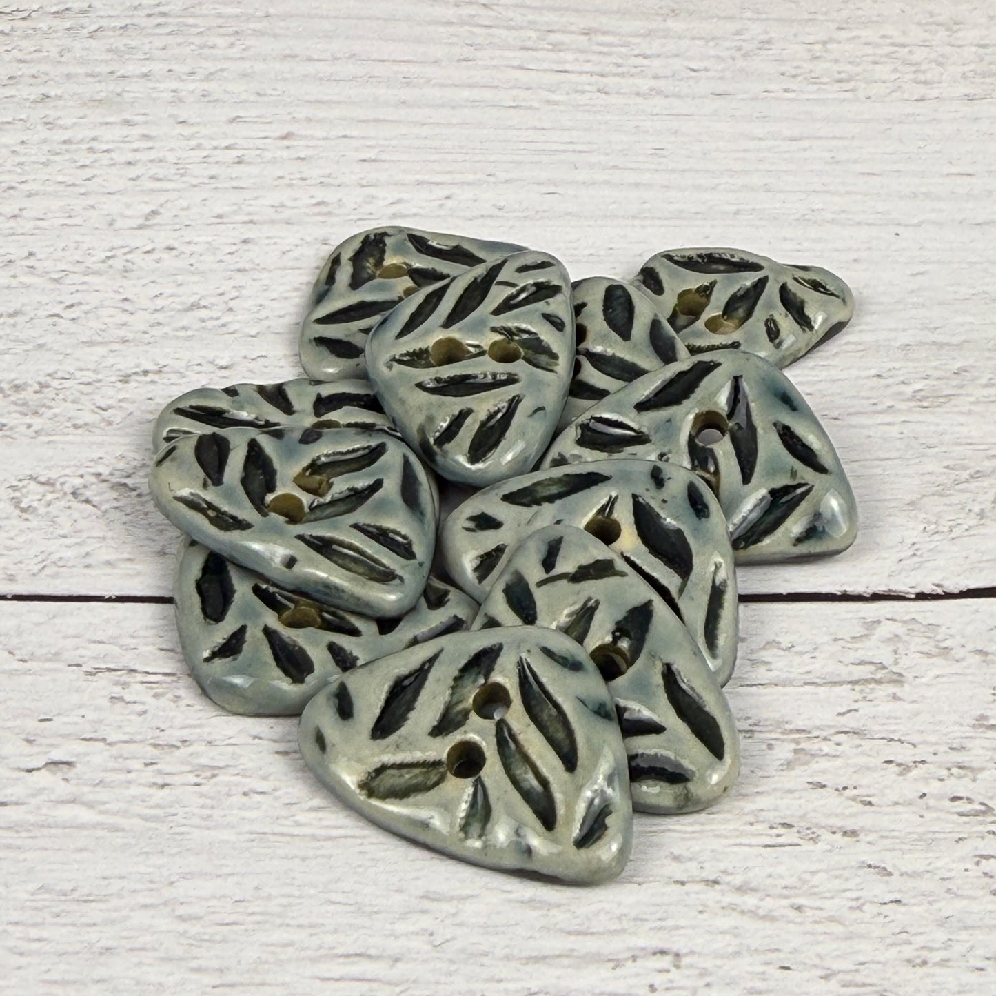 Small Triangular Shaped Buttons in Light Sage with Dark Sage Leaf Pattern