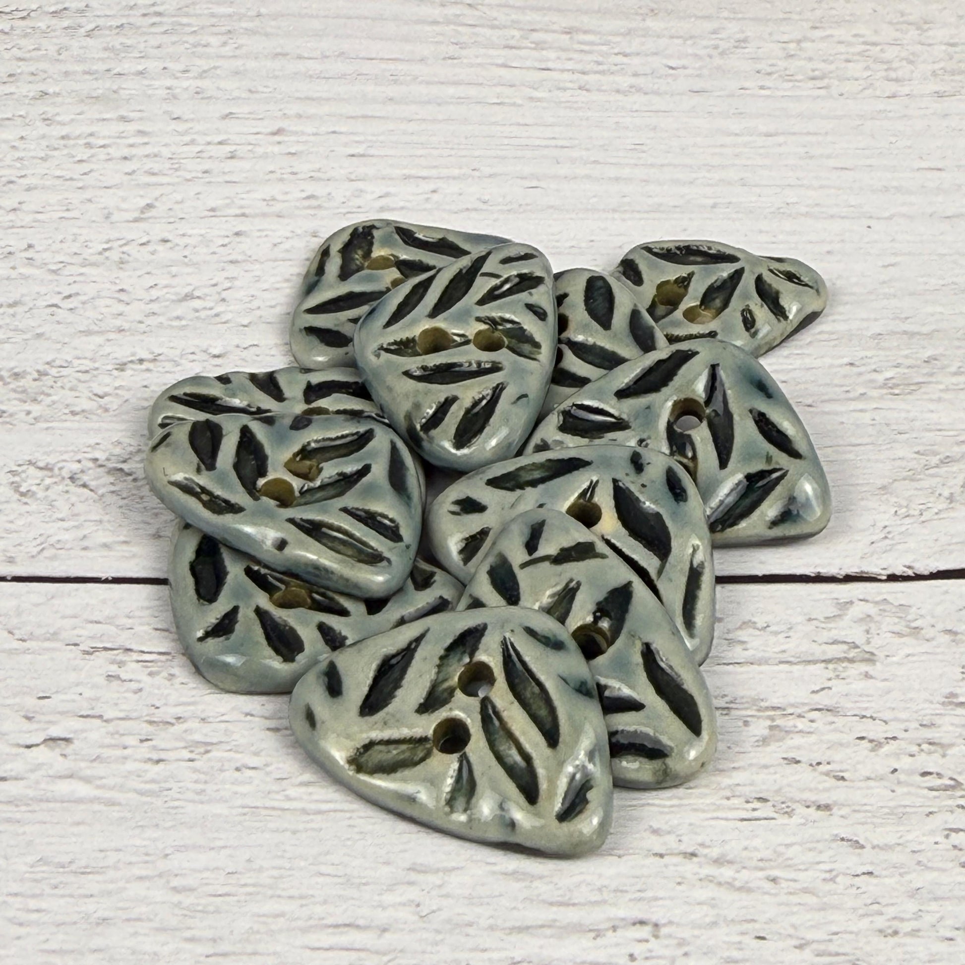 Small Triangular Shaped Buttons in Light Sage with Dark Sage Leaf Pattern