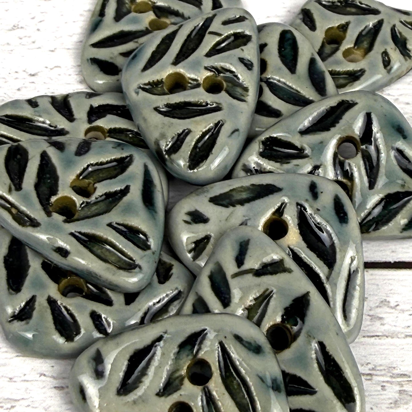 Small Triangular Shaped Buttons in Light Sage with Dark Sage Leaf Pattern