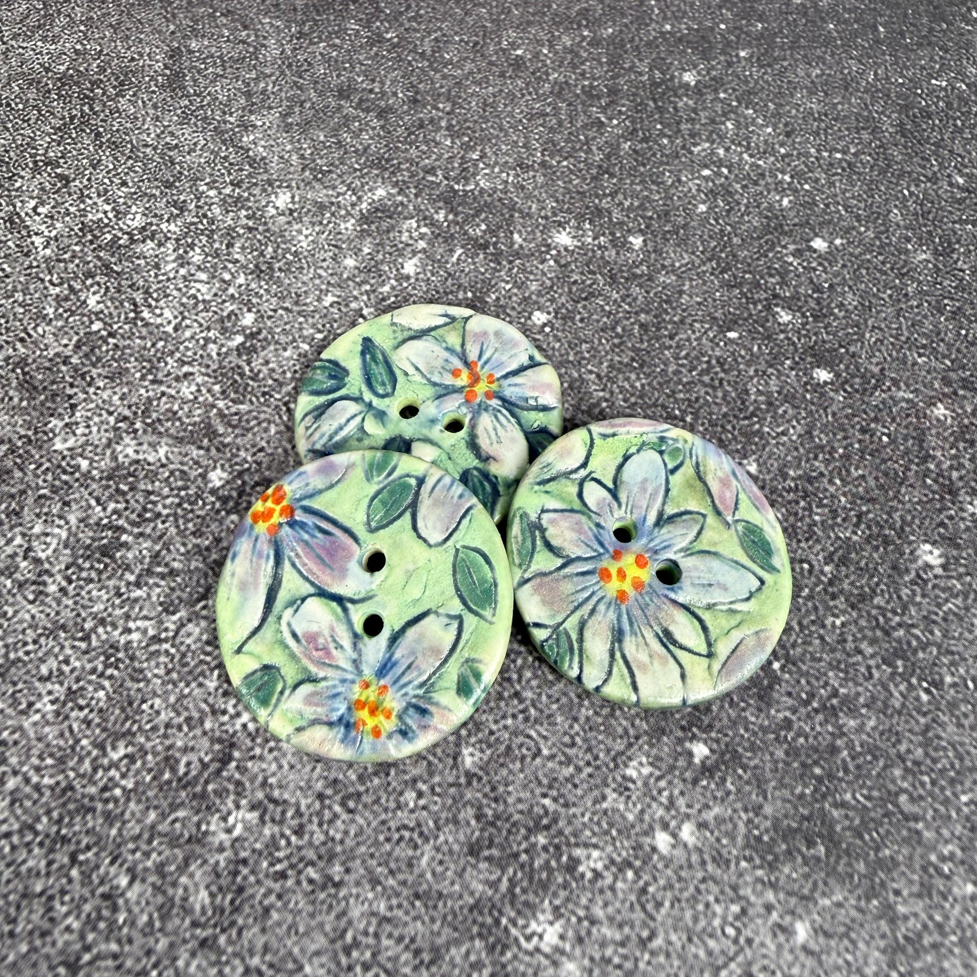 Purple Flowers on Green Round Buttons