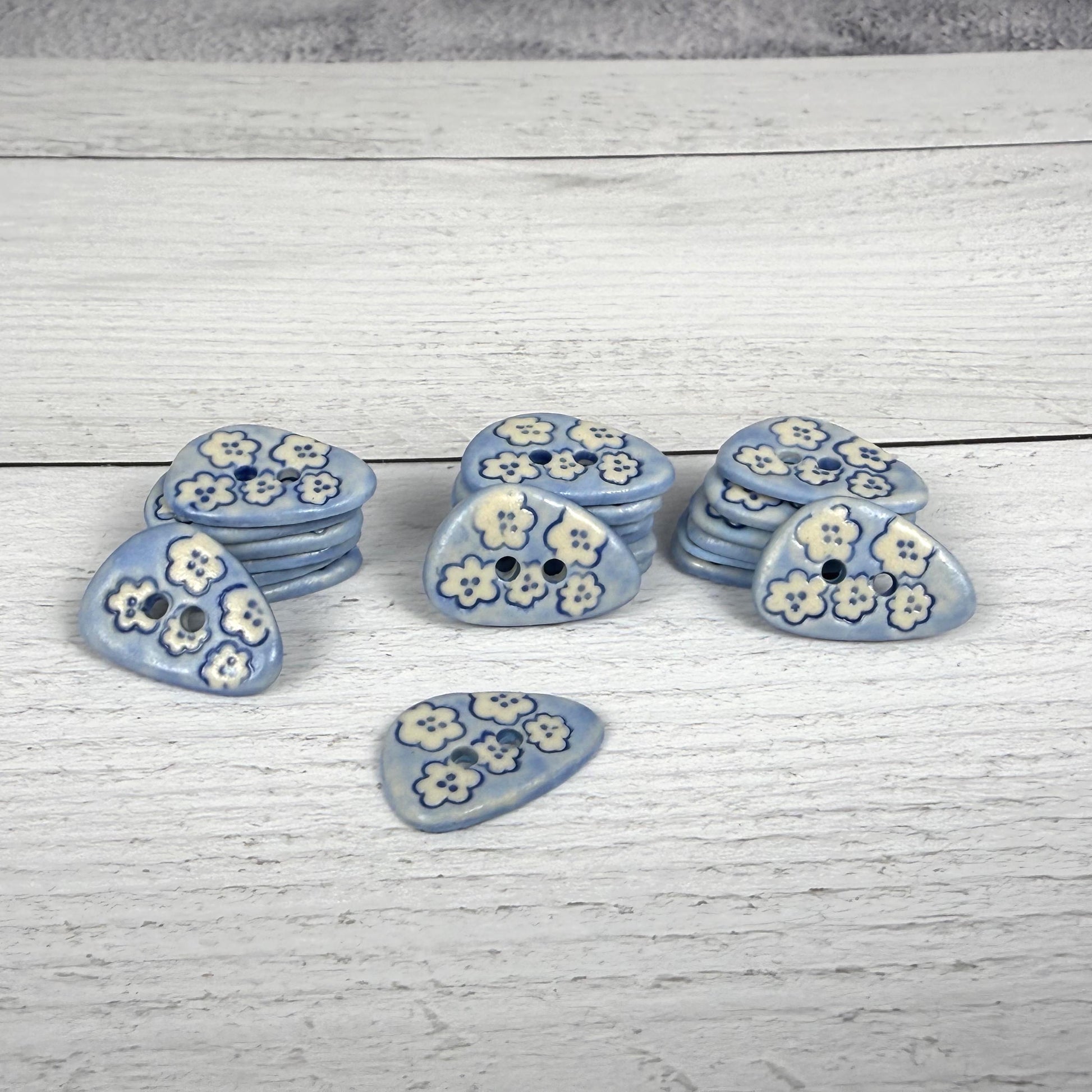 Set of 5 Small Blue Triangular Shaped Buttons with White Flowers
