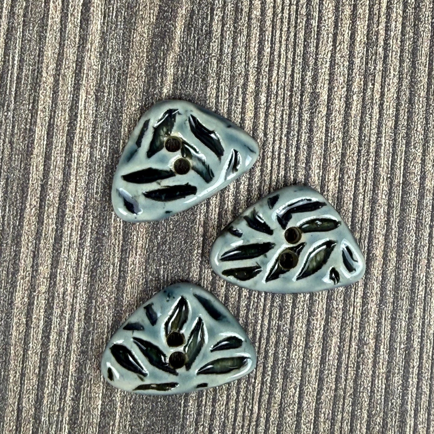 Small Triangular Shaped Buttons in Light Sage with Dark Sage Leaf Pattern