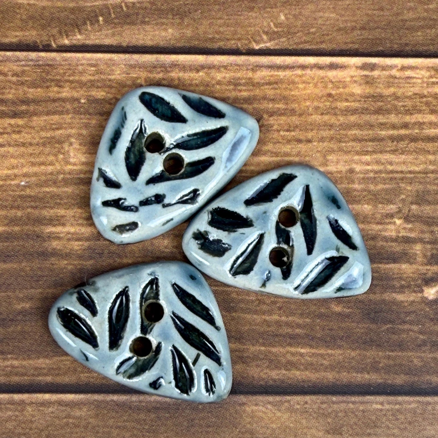 Small Triangular Shaped Buttons in Light Sage with Dark Sage Leaf Pattern