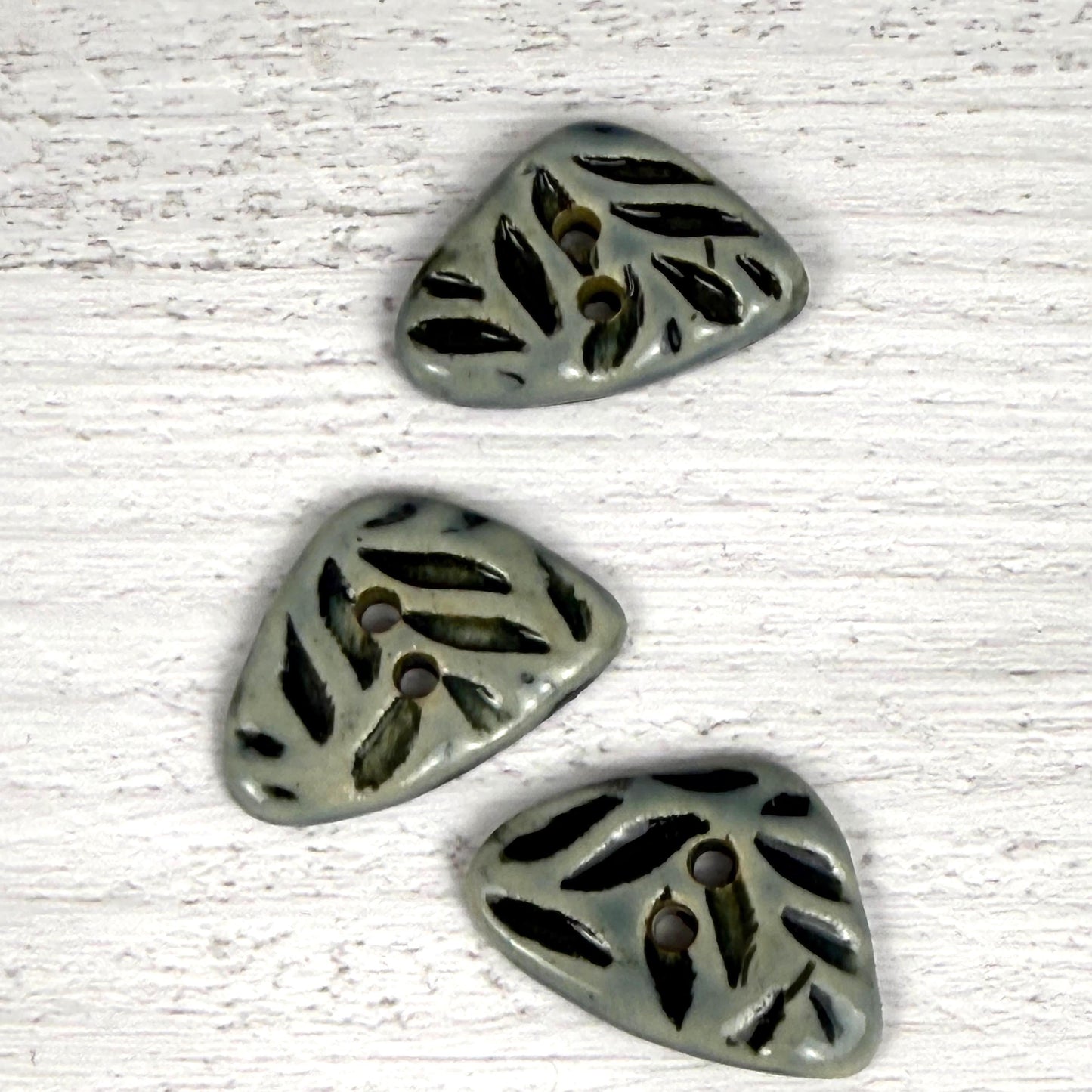 Small Triangular Shaped Buttons in Light Sage with Dark Sage Leaf Pattern